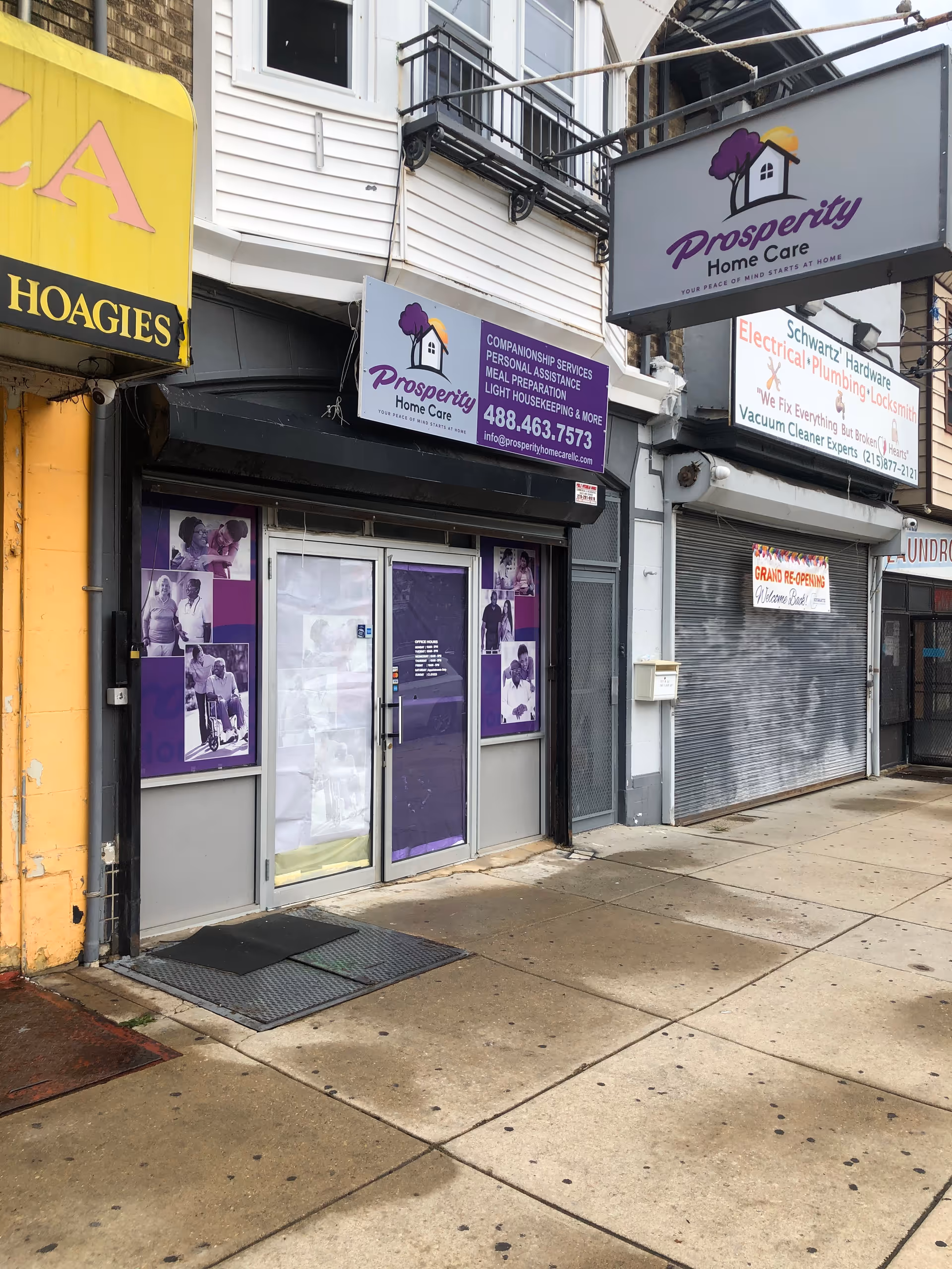 City storefronts with Prosperity Home Care signage on a building front.