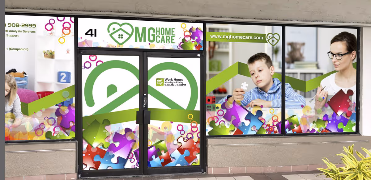 Bright MG Home Care storefront windows with puzzle-piece graphics and people imagery.