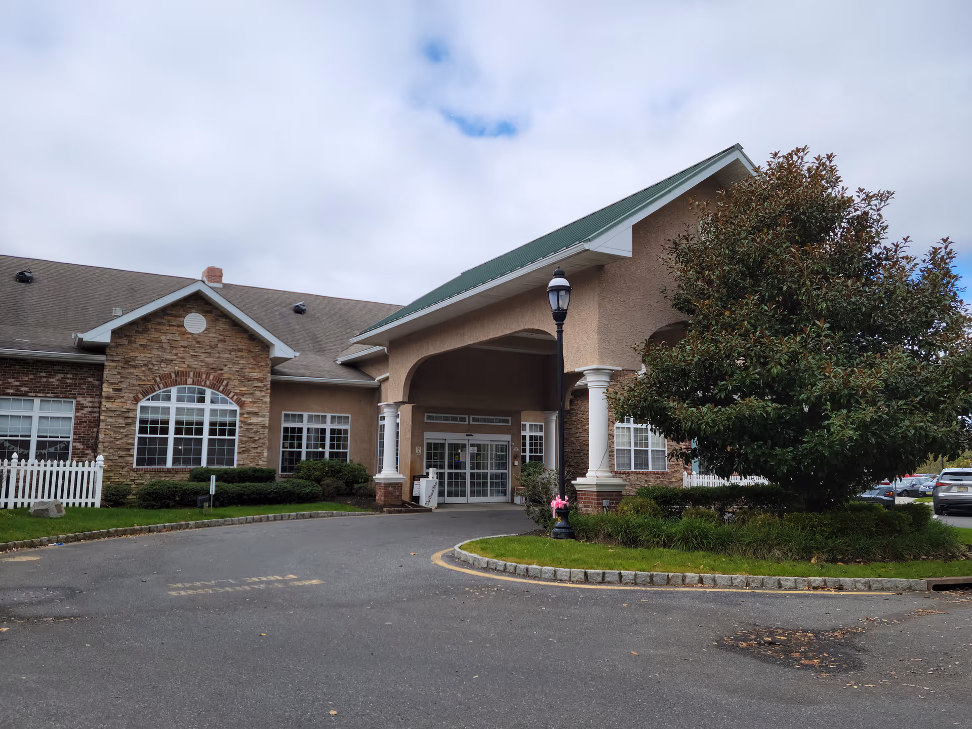 Exterior view of CareOne at Wall entrance with canopy and landscaping