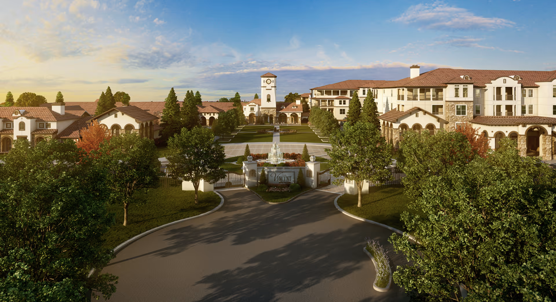 Front exterior view of The Vincent Senior Living facility featuring a gated entrance with a fountain, landscaped greenery, and a large building complex with Mediterranean-style architecture under a partly cloudy sky.