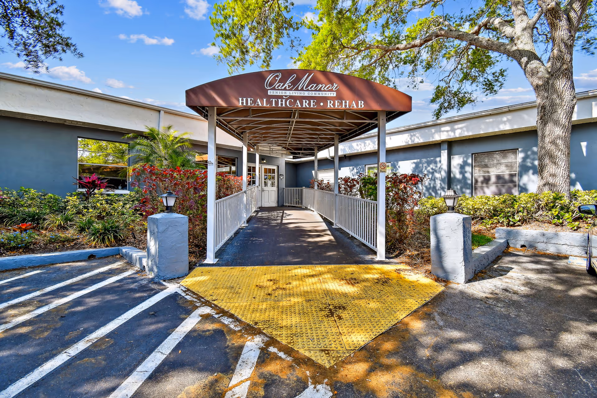 Exterior view of Oak Manor entrance with a covered walkway.