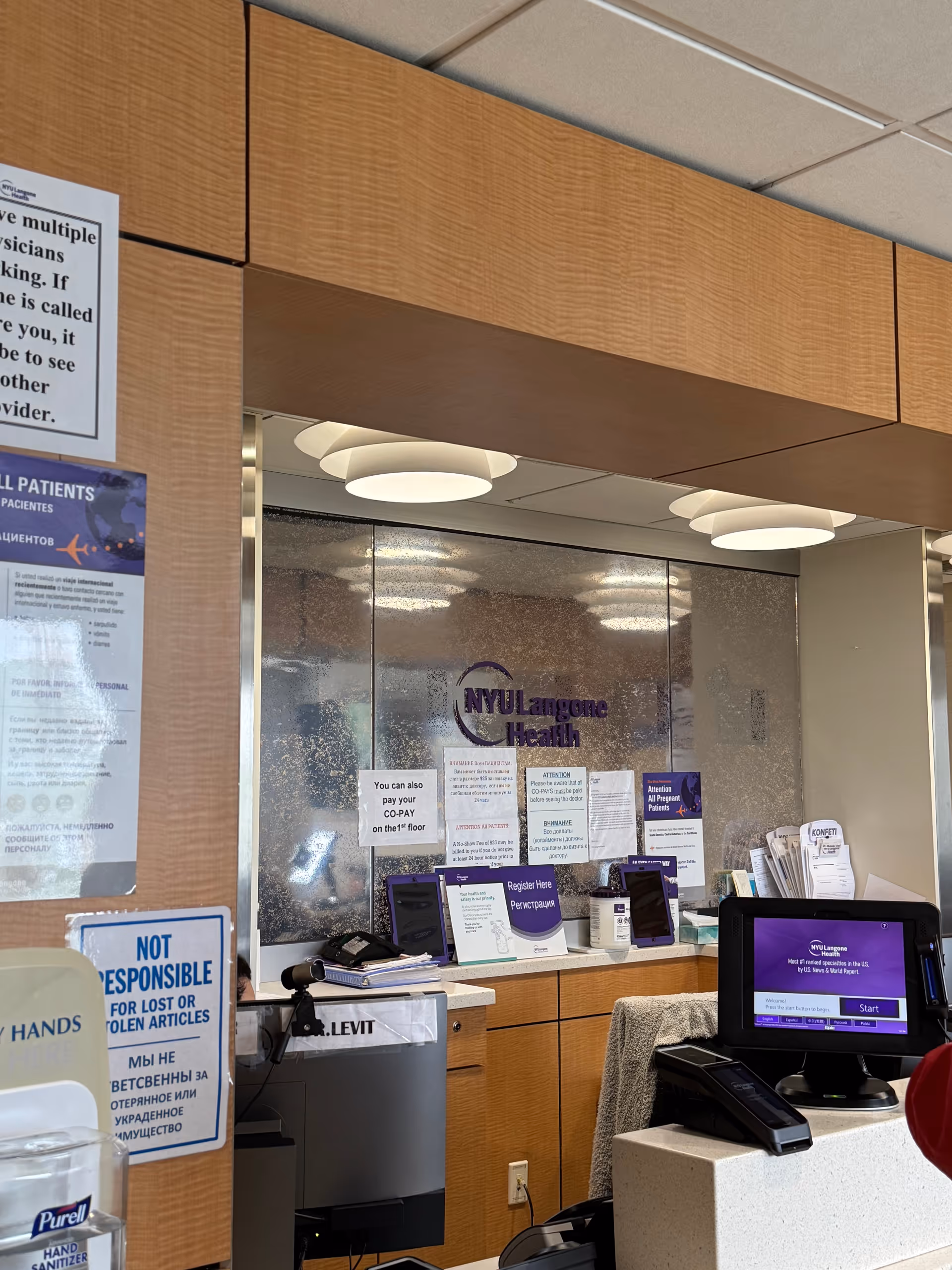 Reception area at NYU Langone Levit Medical with a front desk and signage.