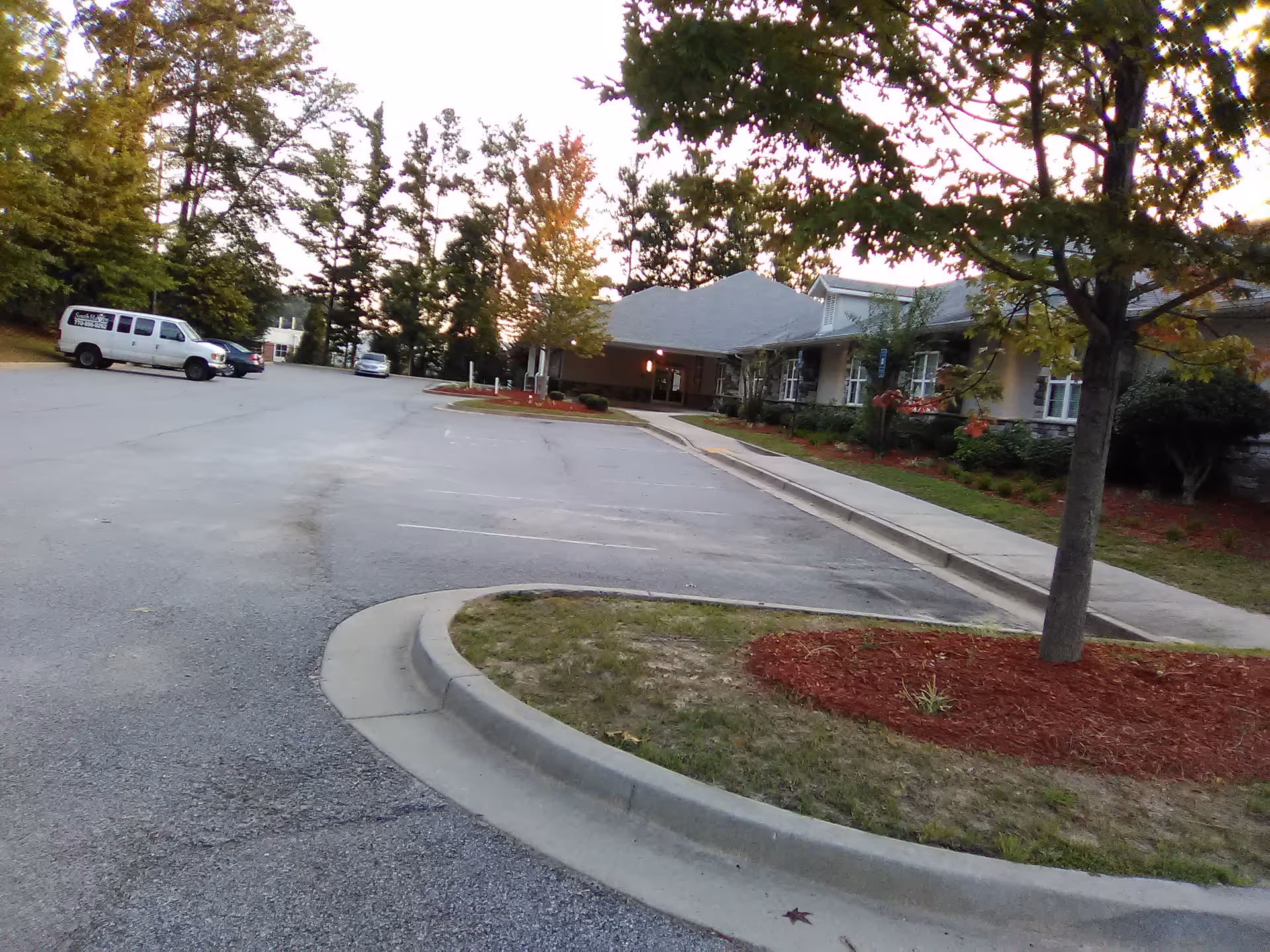 Exterior view of South Haven Personal Care Home and Transportation with parking lot.