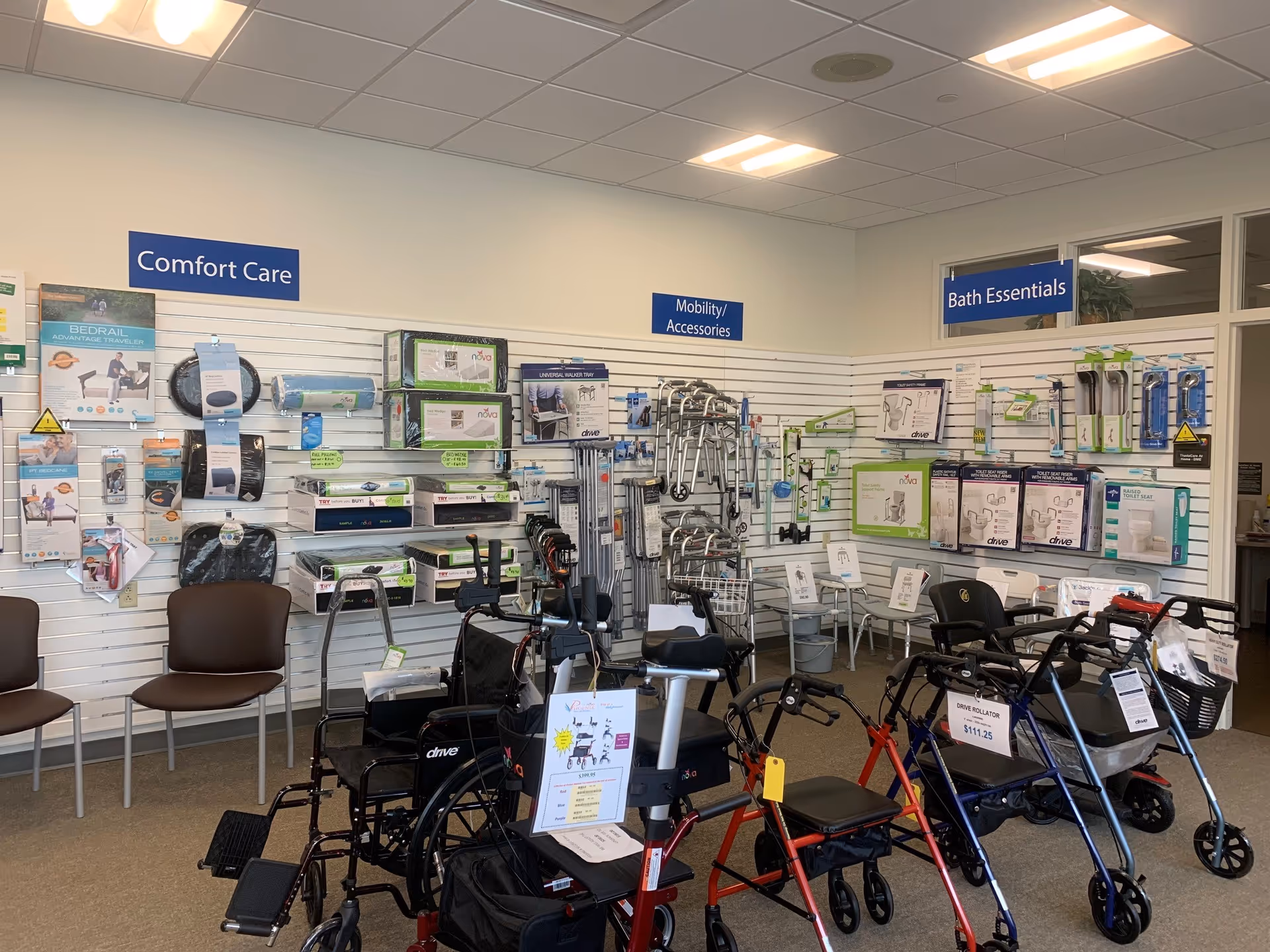 Interior showroom displaying mobility aids and bathroom accessories on wall shelves.