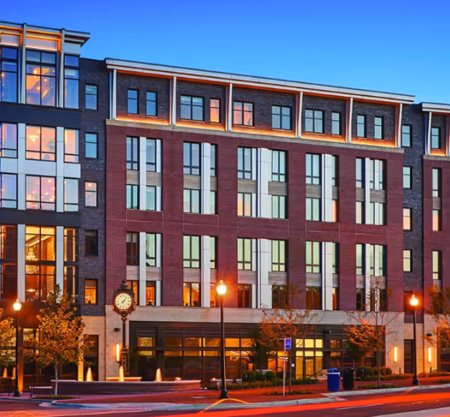 Exterior view of Cogir of Alexandria Fillmore, a multi-story brick senior living building.