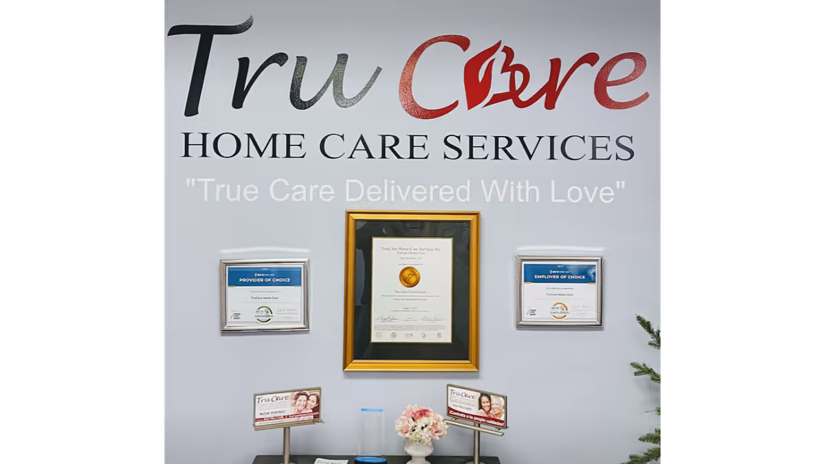 Interior wall with TruCare Home Care Services sign and framed certificates.