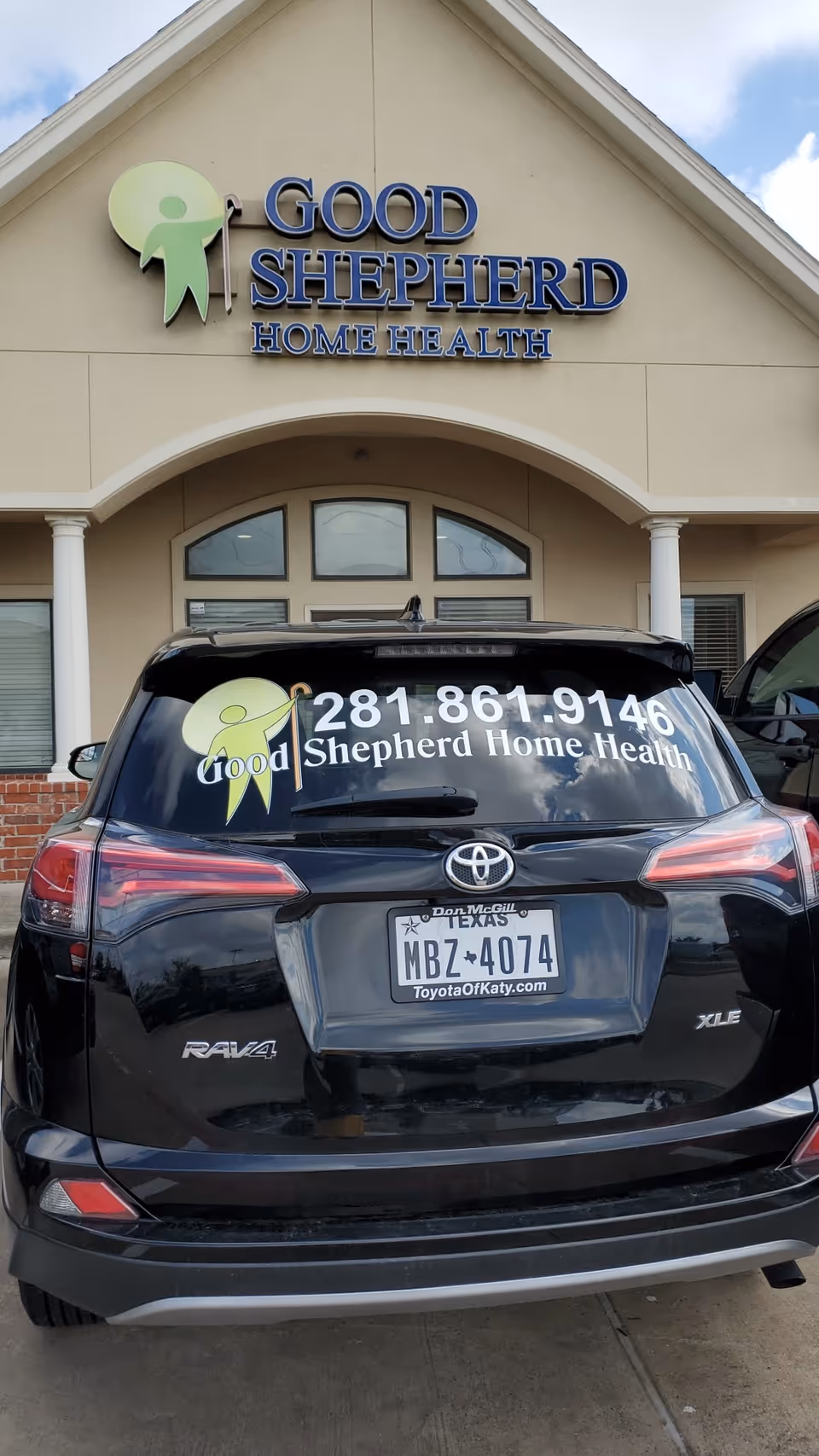 Front view of Good Shepherd Home Health building with a logoed SUV parked outside.