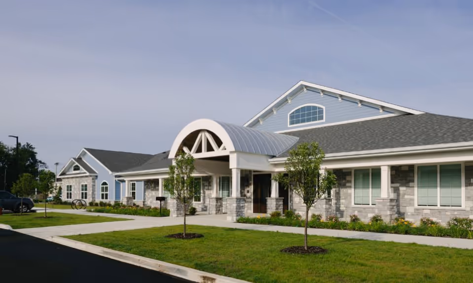 Exterior view of Chapters Living of South Bend, a modern senior living building with landscaped front.