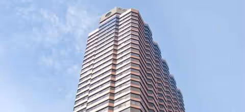 Tall, modern high-rise exterior of Brookdale Lake Shore Drive against a clear blue sky.