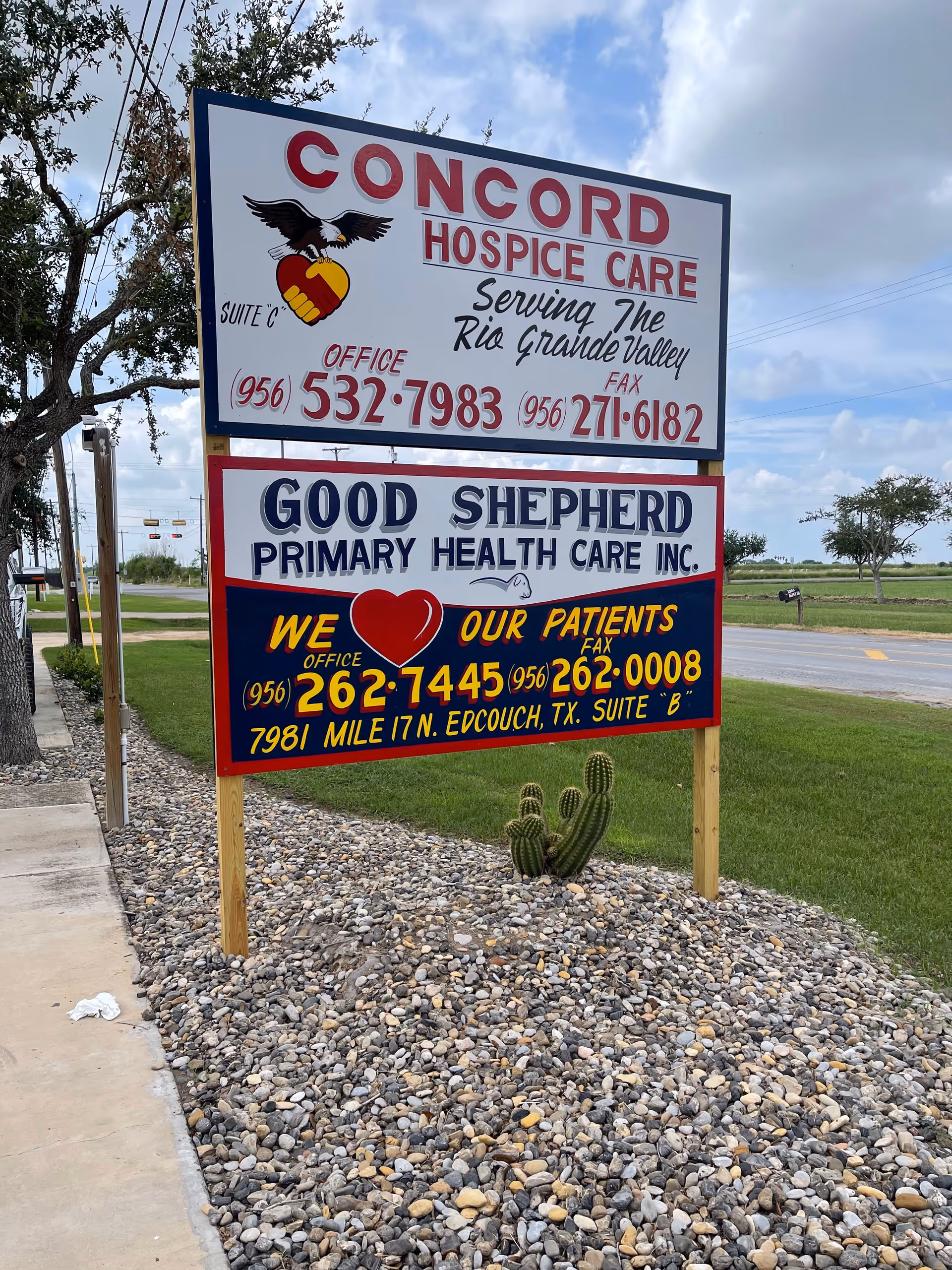 Outdoor signboard for Concord Hospice Care and Good Shepherd Health Care on a gravel lot.