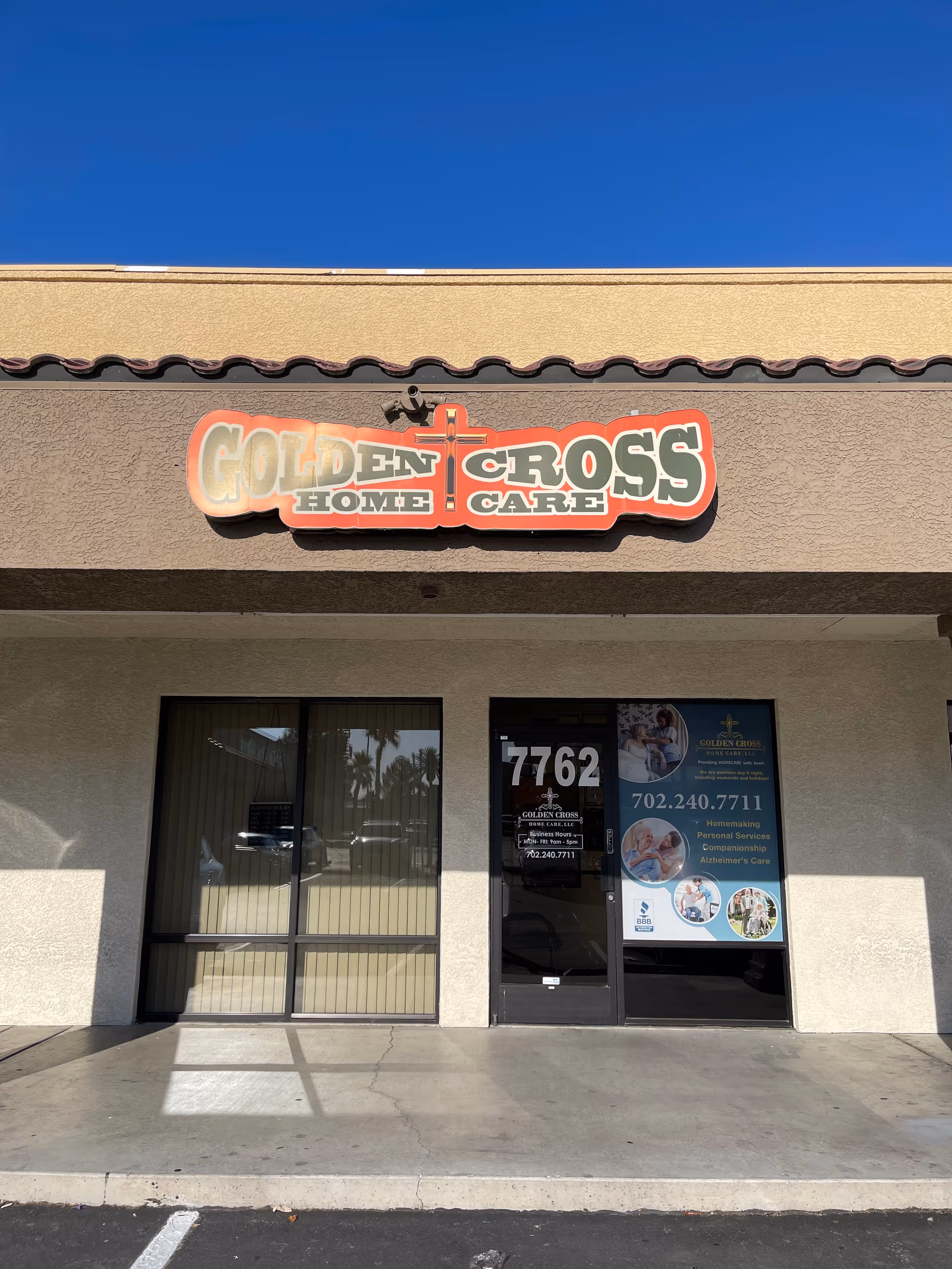 Front view of Golden Cross Home Care storefront with large sign and glass doors.