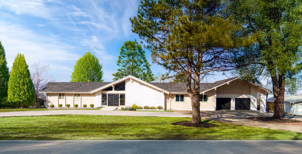 Exterior view of Legato Living at Skyline, a single-story senior facility with a front entrance.