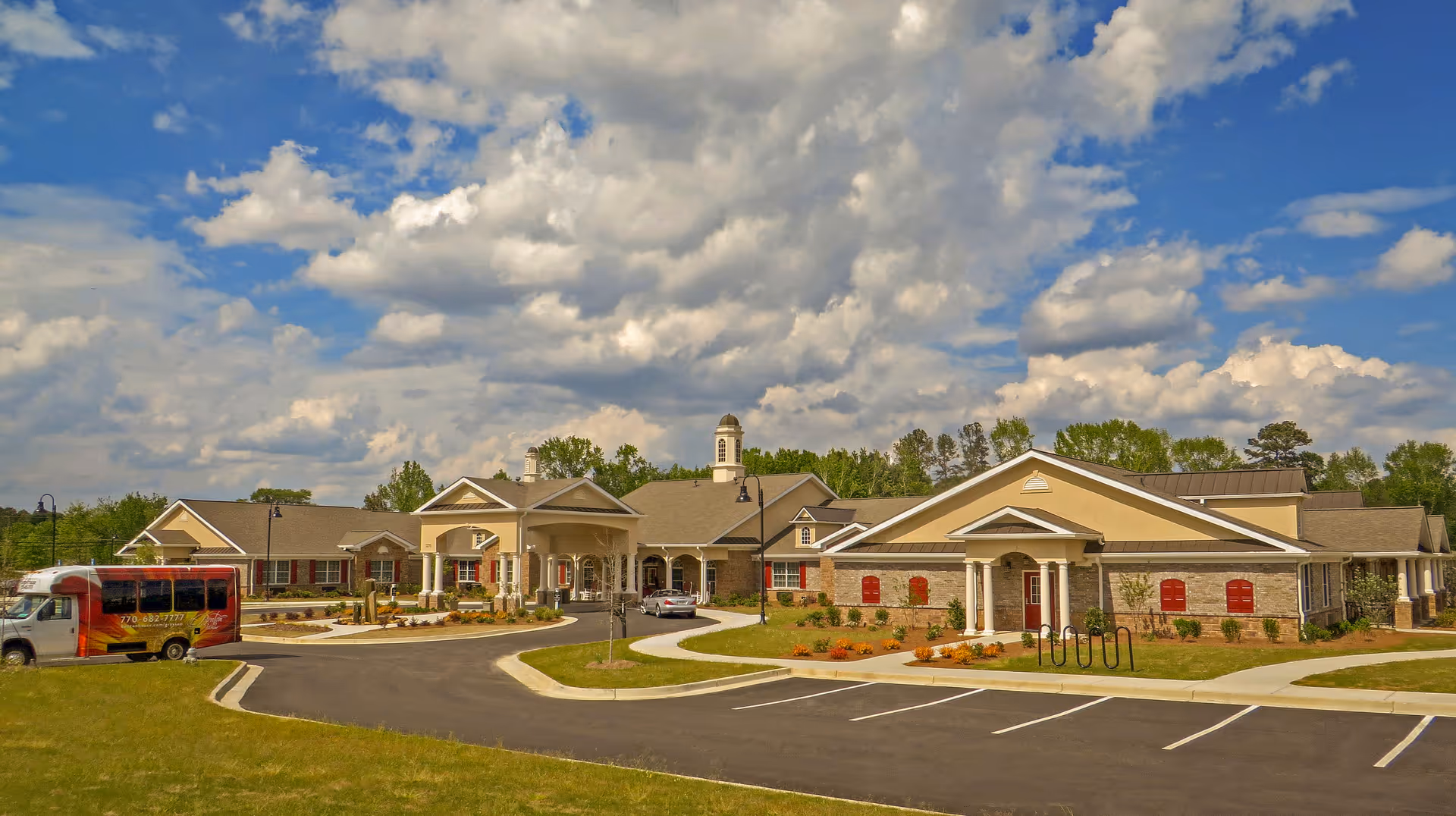 Exterior view of Benton House of Grayson, a senior living facility with a circular driveway.