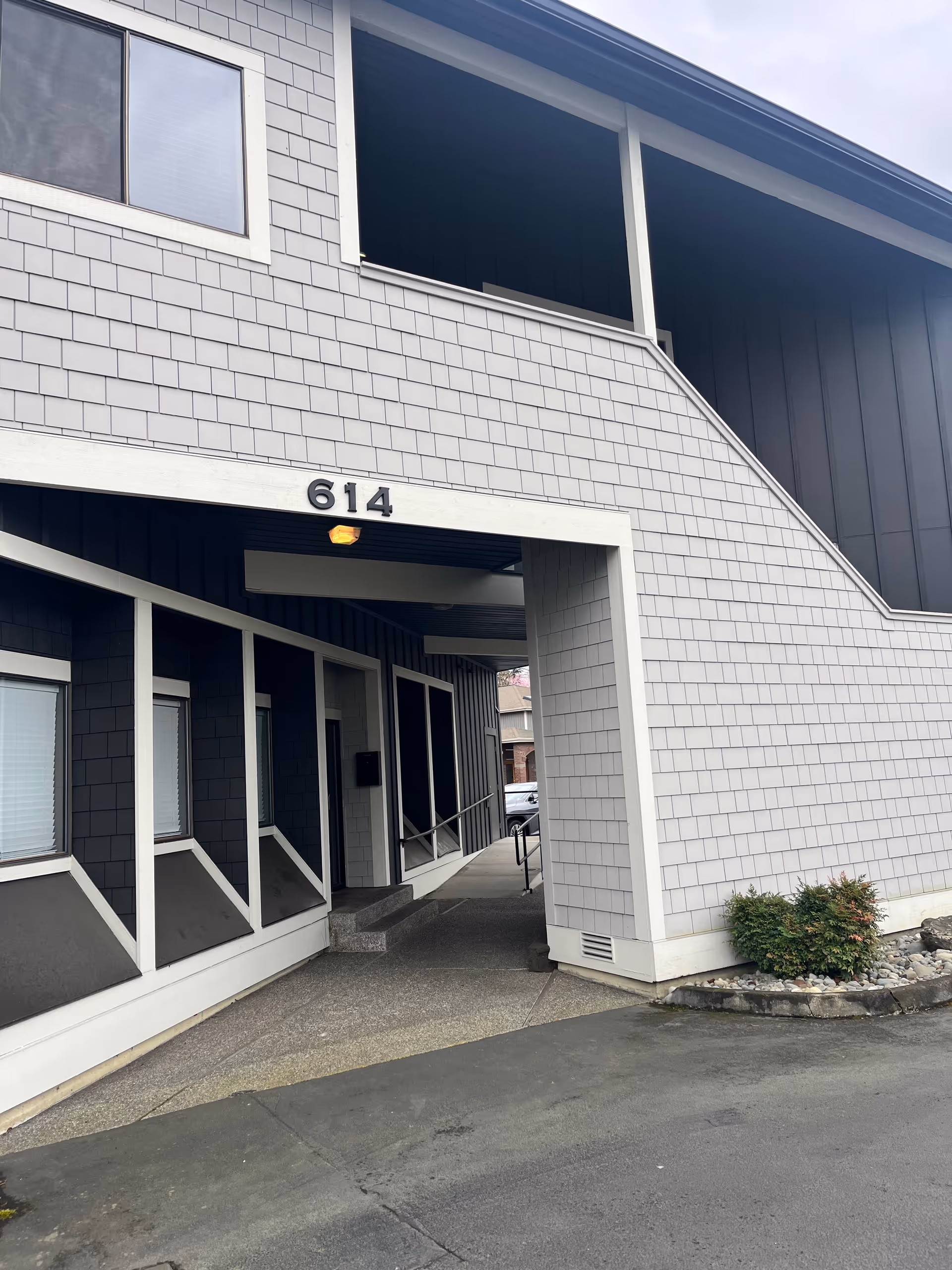 Exterior view of a senior living facility entrance with the number 614.