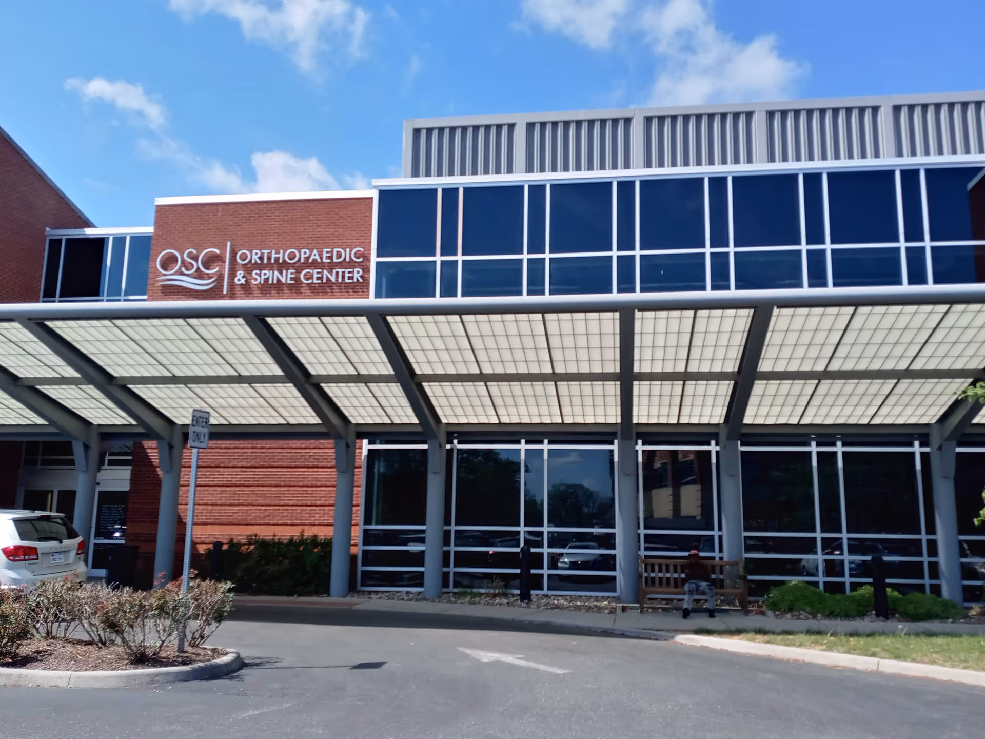 Modern medical building with OSC Orthopaedic & Spine Center sign and glass facade.