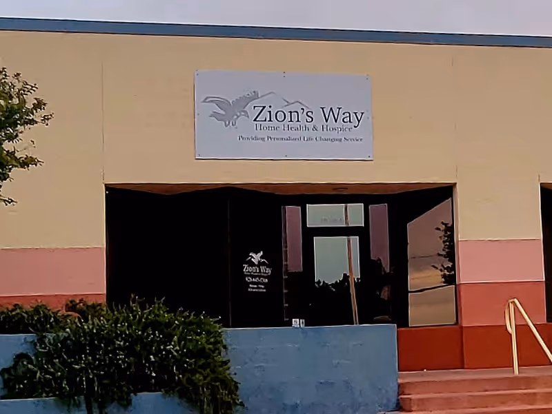 Front view of Zion's Way Home Health & Hospice building with sign above entrance.