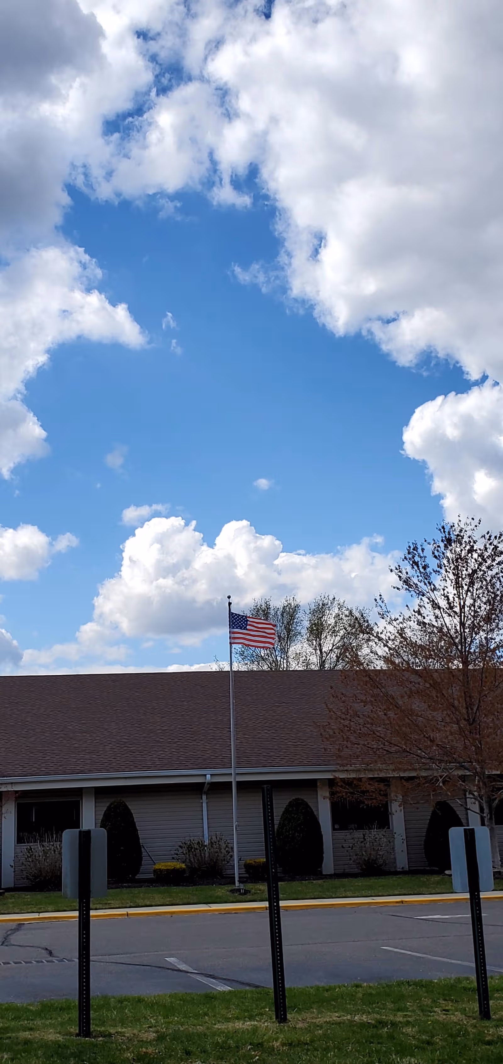 American flag in front of Crestwood Village Co-Op IV exterior building