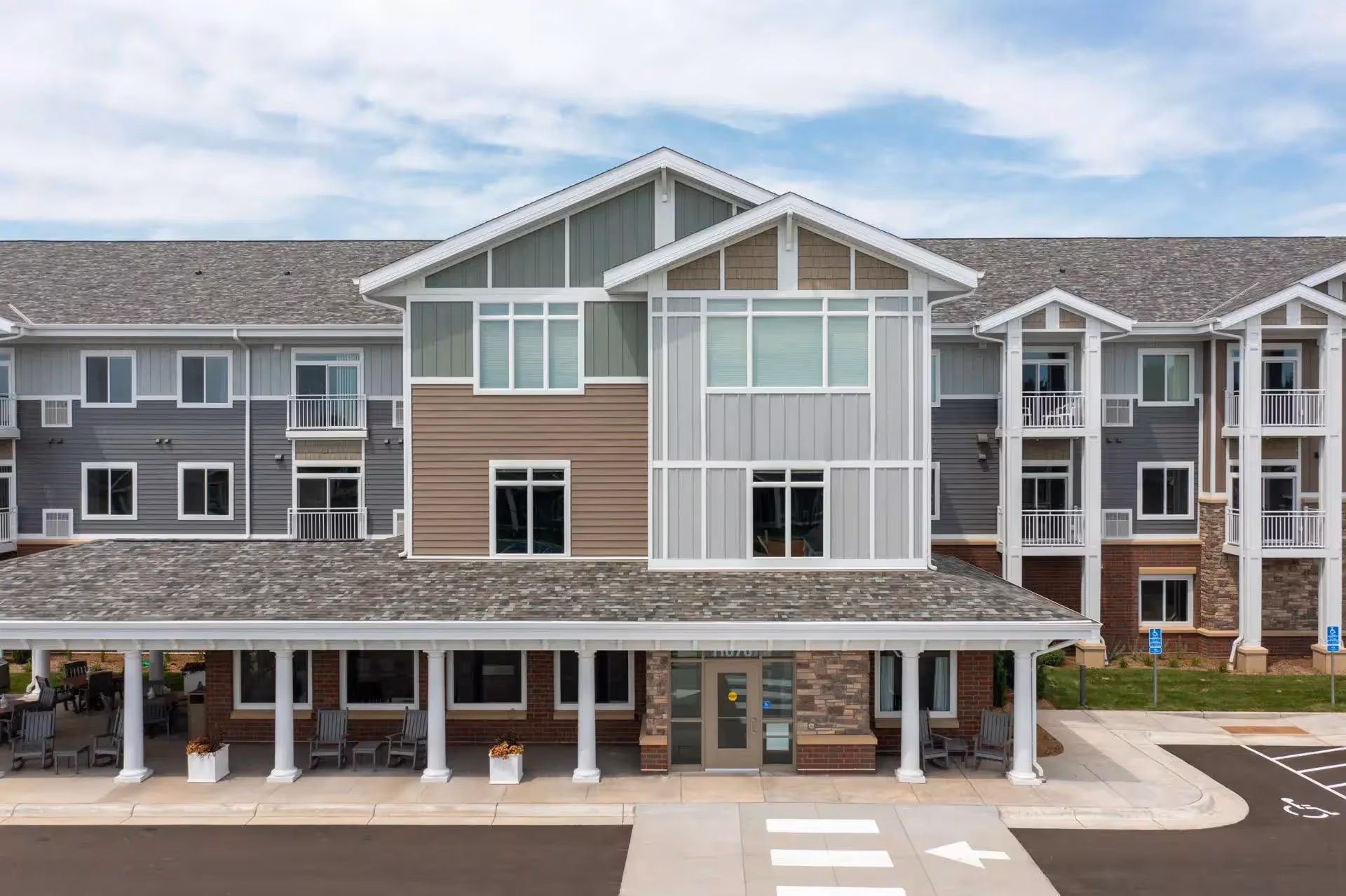 Exterior view of The Fields by New Perspective, a multi-story senior living building.