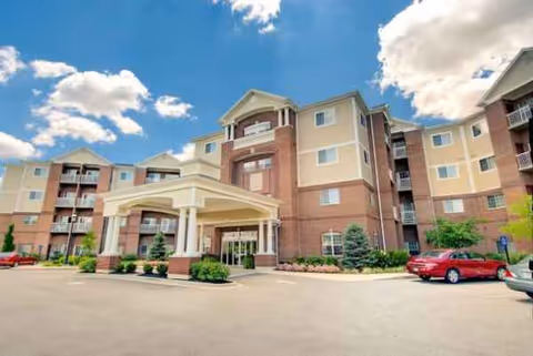 Exterior view of Barrington of Oakley showing the entrance to a multi-story senior living building.