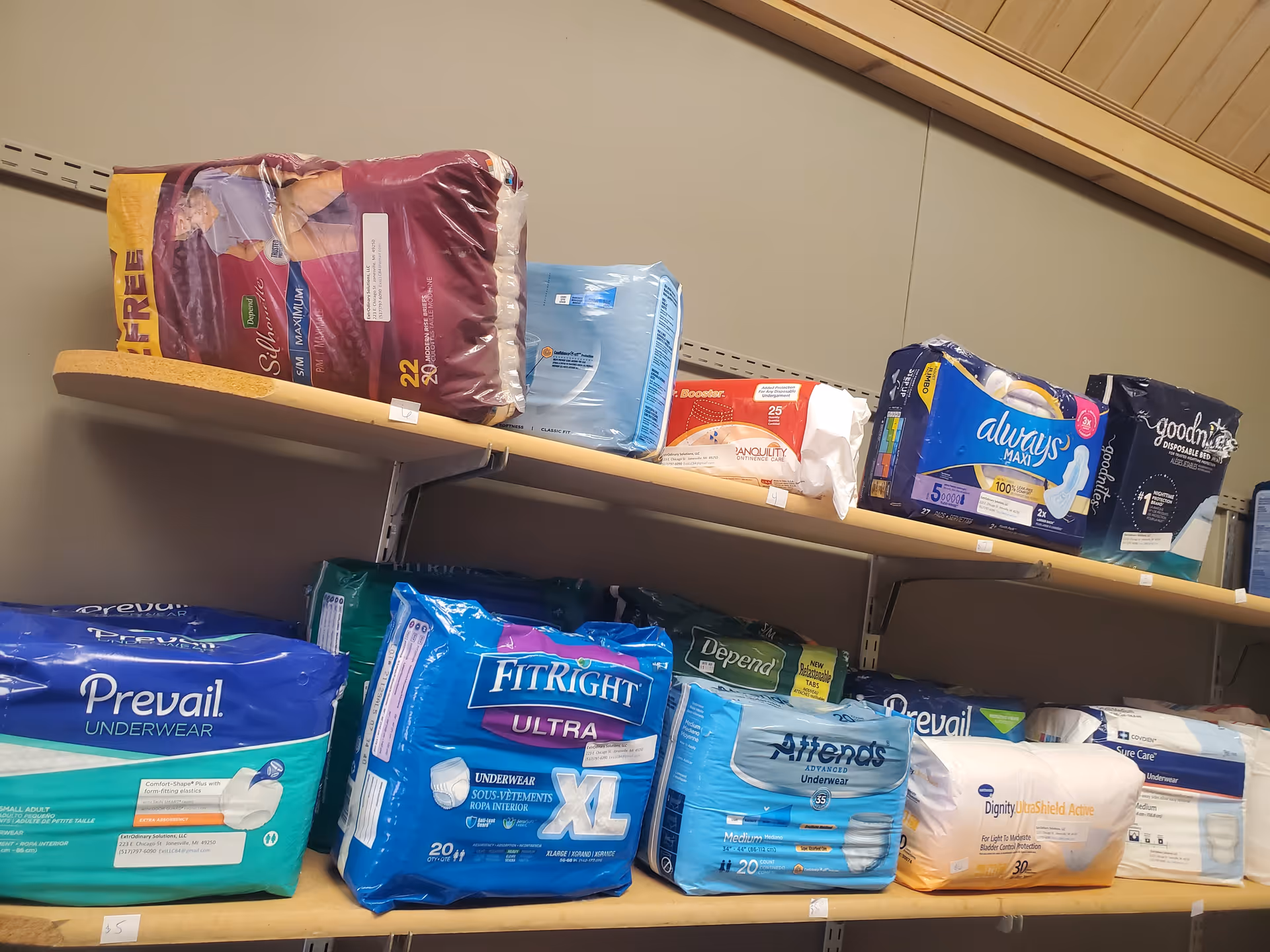 Shelves stocked with adult incontinence products in a storage room