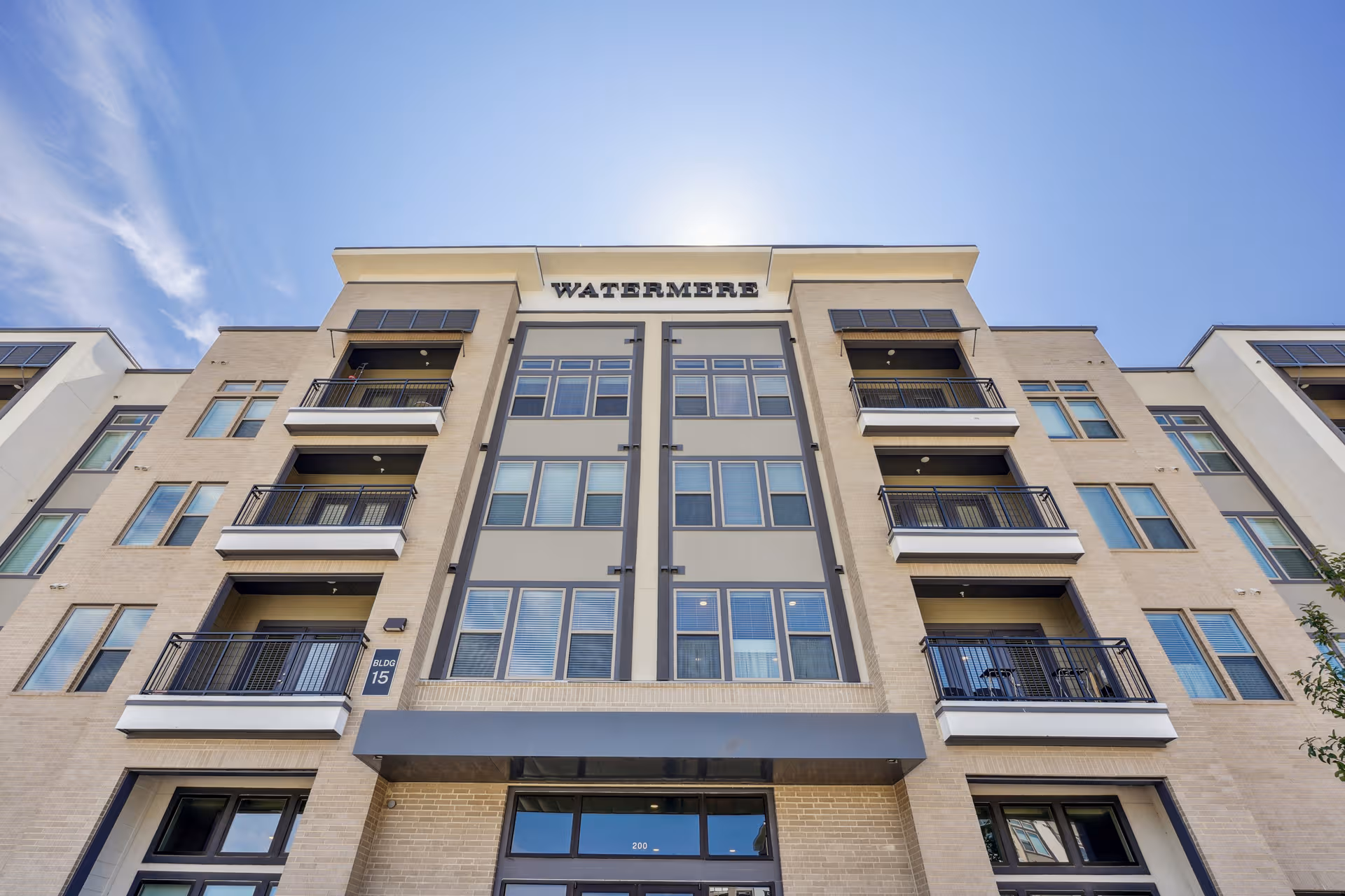 Facade of Watermere at Round Rock, a modern, multi-story senior living building.