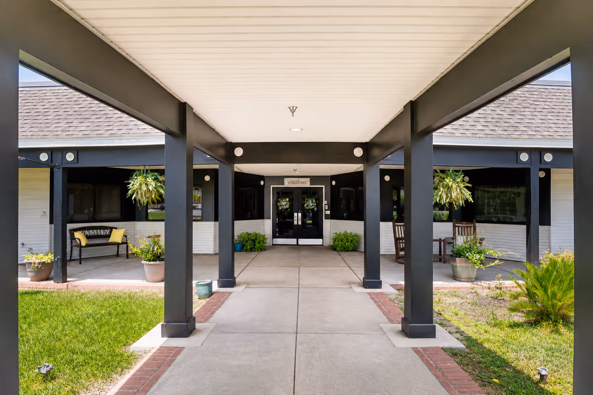 Covered walkway leads to the front entrance of Garden Court Health and Rehabilitation Center.