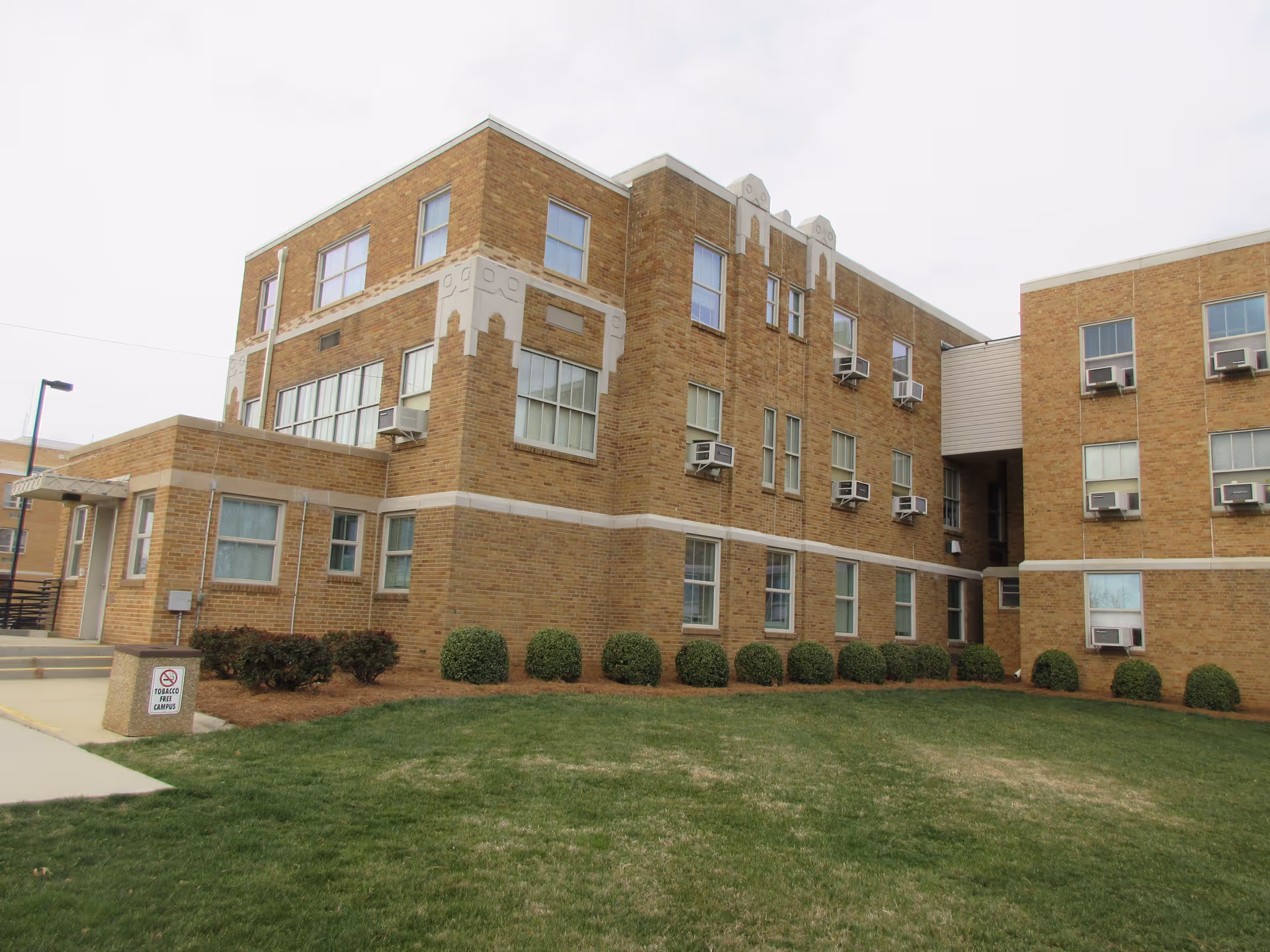 Randolph Health senior living facility exterior with lawn and shrubs