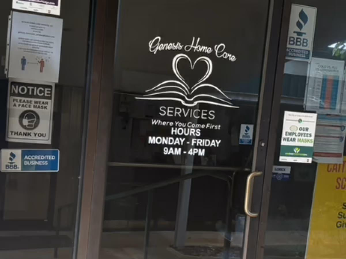 Entrance doors with Genesis Home Care Services logo and notices.