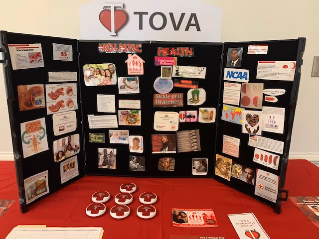 Three-panel health information display on a red table under a TOVA sign.