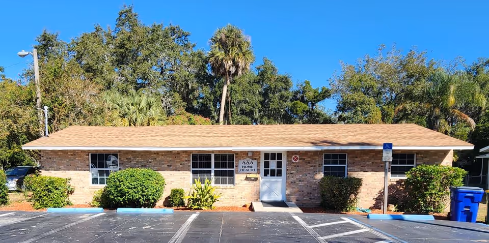 Front view of AAA Referral and Home Health Corp building with parking.