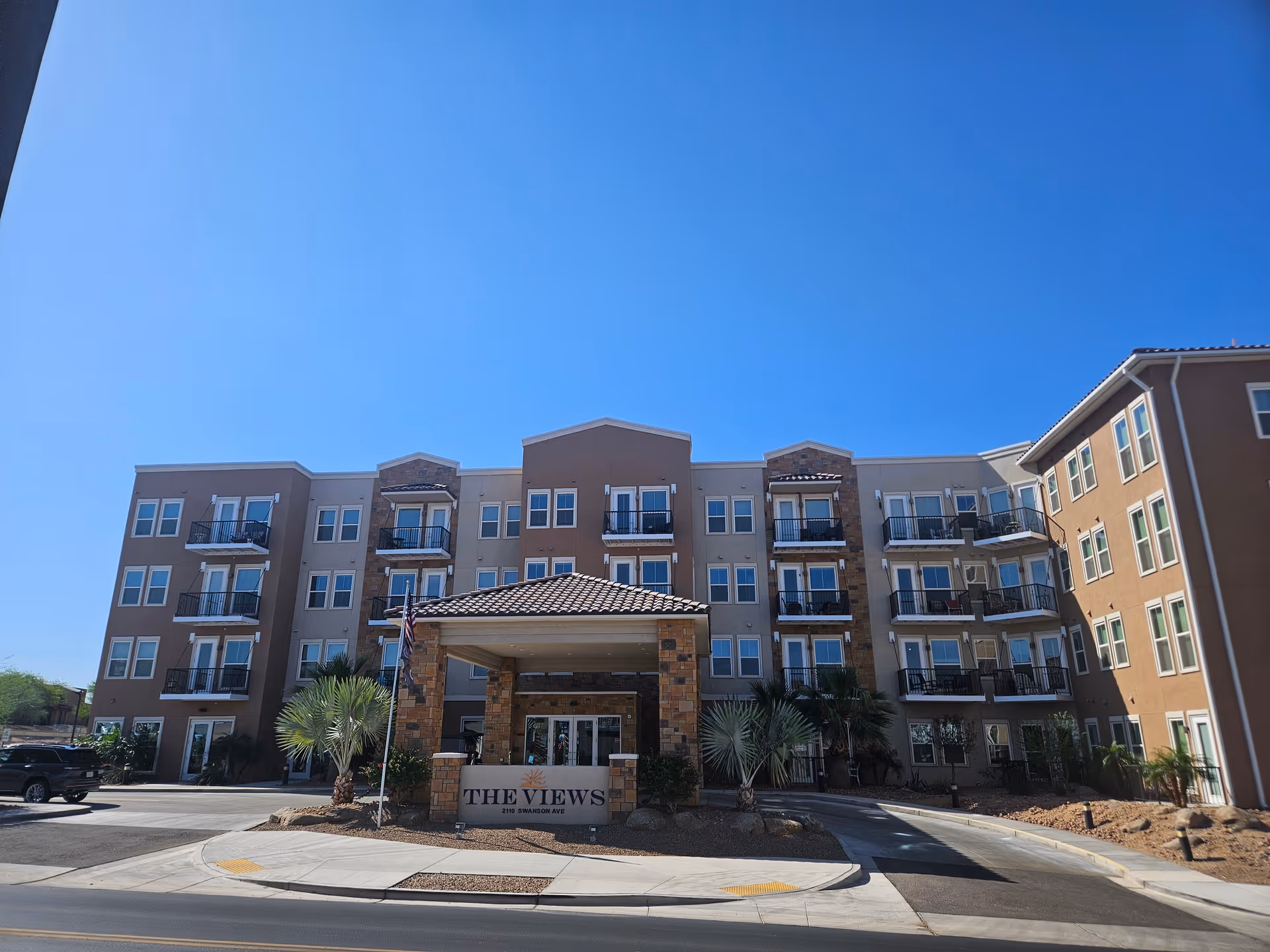 Exterior view of The Views at Lake Havasu Independent Living building with entrance canopy.