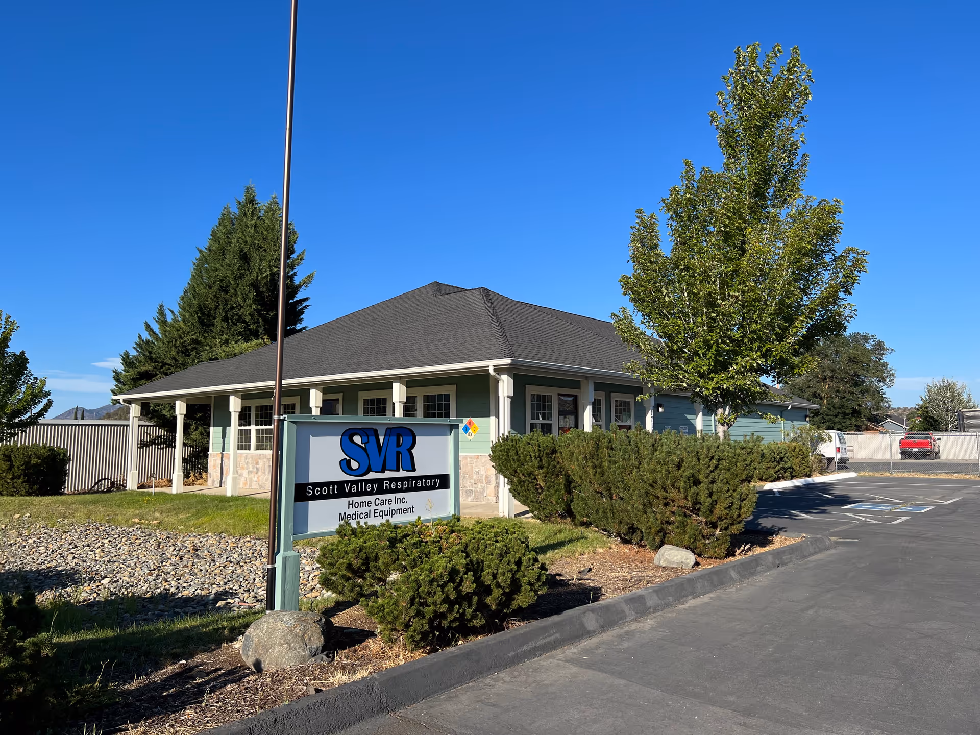 Exterior view of SVR Home Care facility with sign and parking lot.