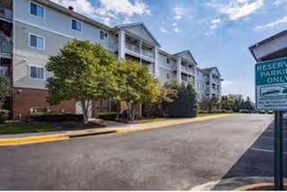 Exterior view of River Run at Prince William Commons, a multi-story senior living building.