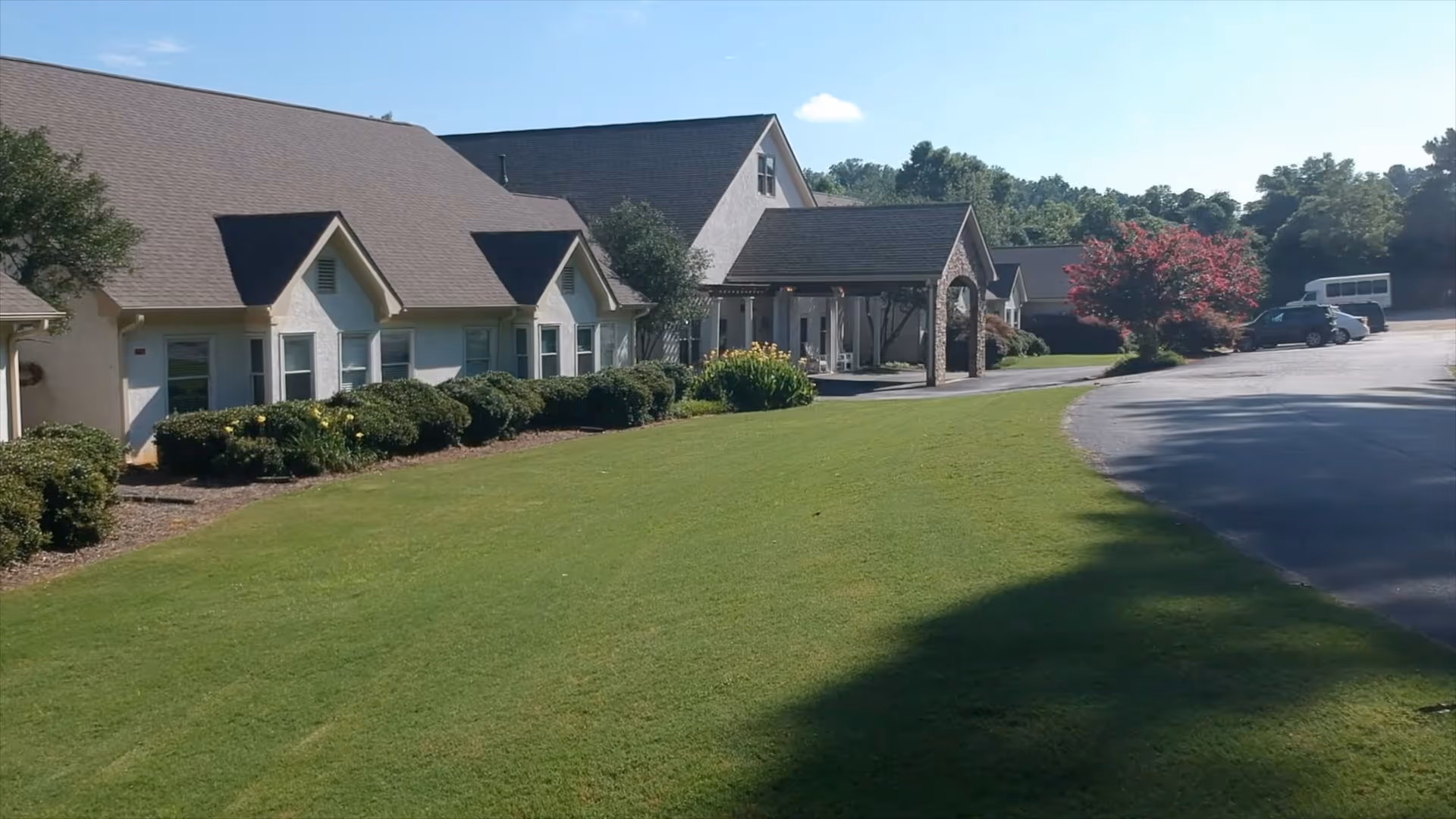 Exterior view of Goldencrest at Morrow Memory Care with a manicured lawn.