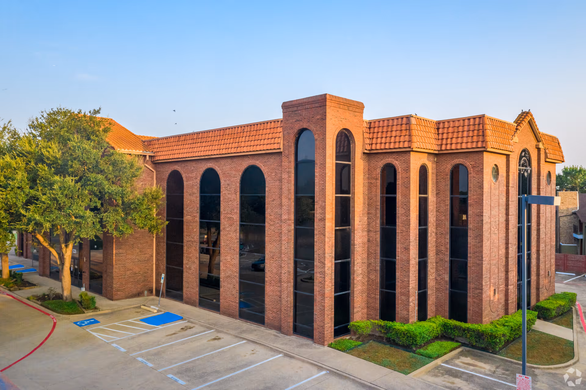 Legacy Home Health Care building exterior with brick arches and large arched windows