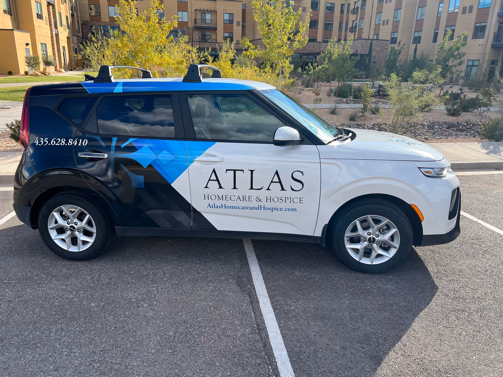 Atlas Homecare and Hospice vehicle branded for Southern Utah in parking lot.