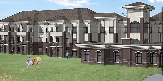 Rendering of a large multi-story senior living facility building with a combination of brick and light-colored exterior walls, multiple windows, and a tower-like structure on the right side. There is a grassy lawn in front with a few people walking, including a family with children.