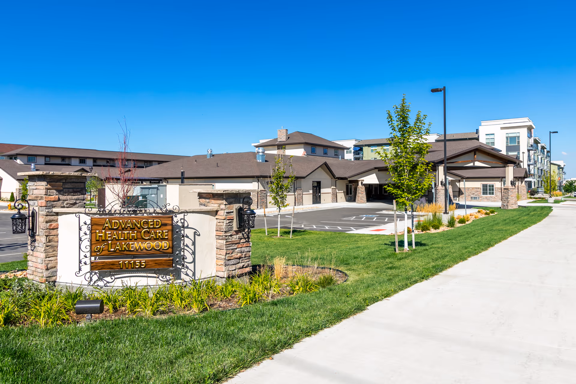 Exterior view of Advanced Health Care of Lakewood with sign, parking, and landscaped entrance.