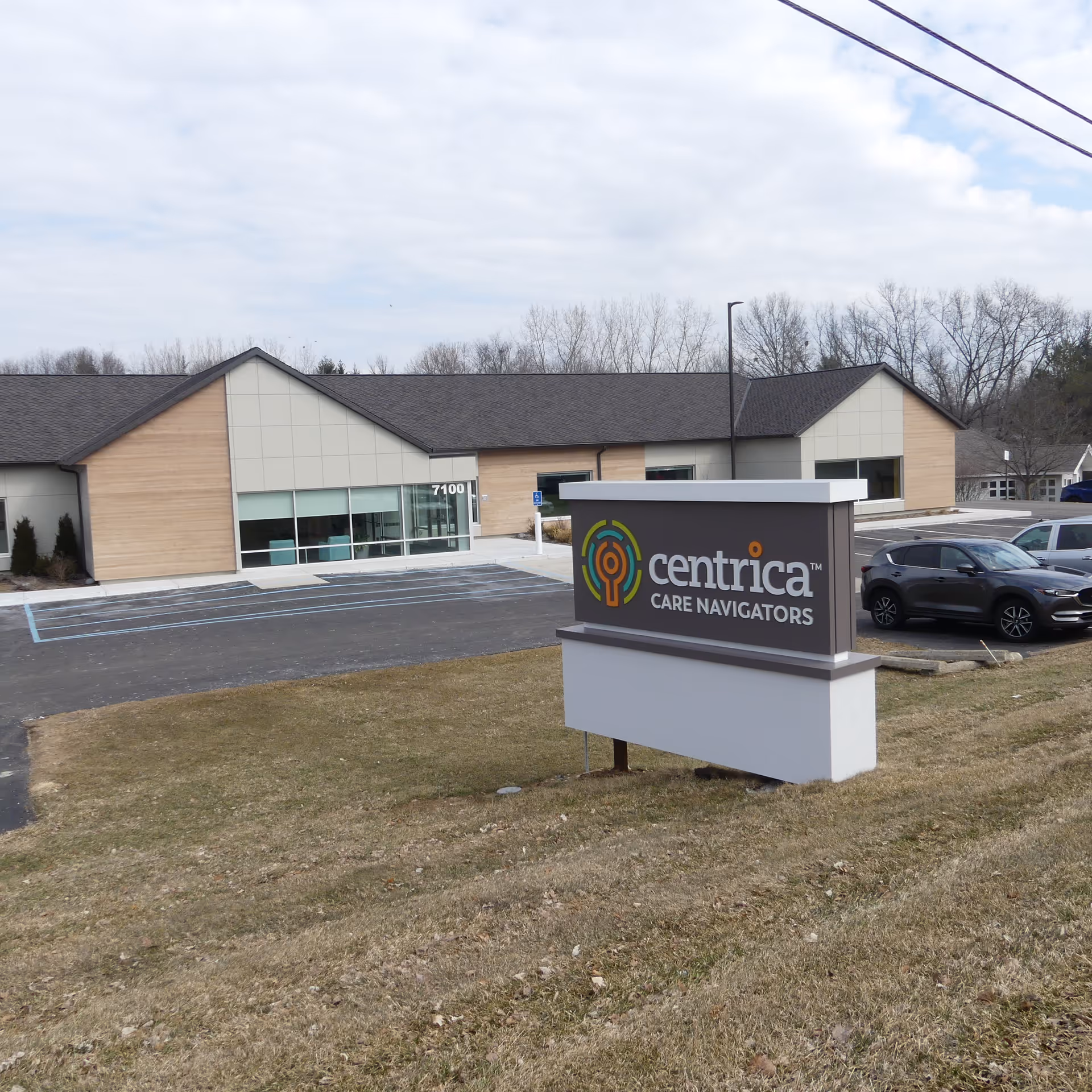 Exterior view of Centrica Care Navigators building with a large sign.