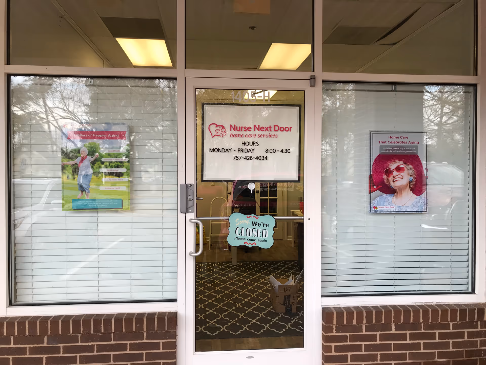 Front entrance of Nurse Next Door Home Care Services with glass doors and signs.