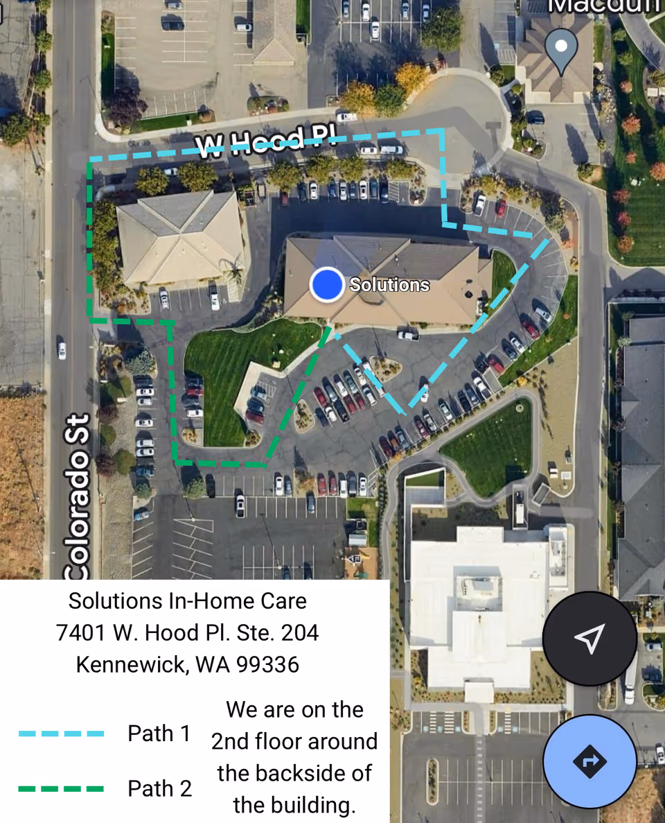 Aerial view of Solutions In-Home Care building with surrounding parking lots.