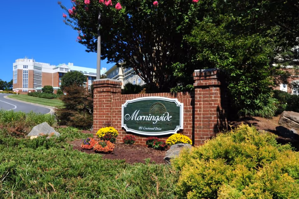Brick entrance sign reading 'Morningside' surrounded by landscaping with the facility building visible in the background.