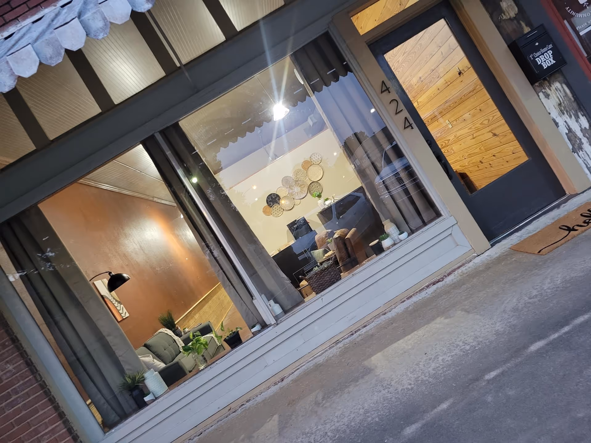 Storefront of 1st Choice Home Care, Inc. Dewitt, with living room visible through the front window.