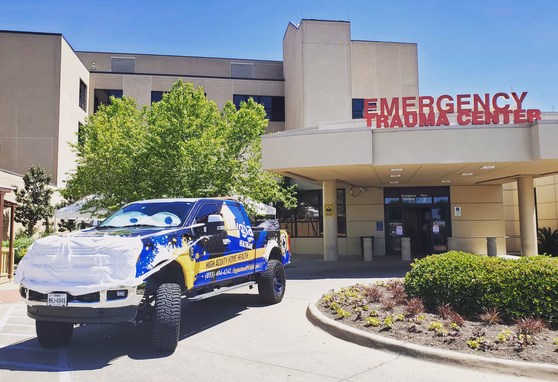 Exterior view of emergency trauma center with a truck parked in front.