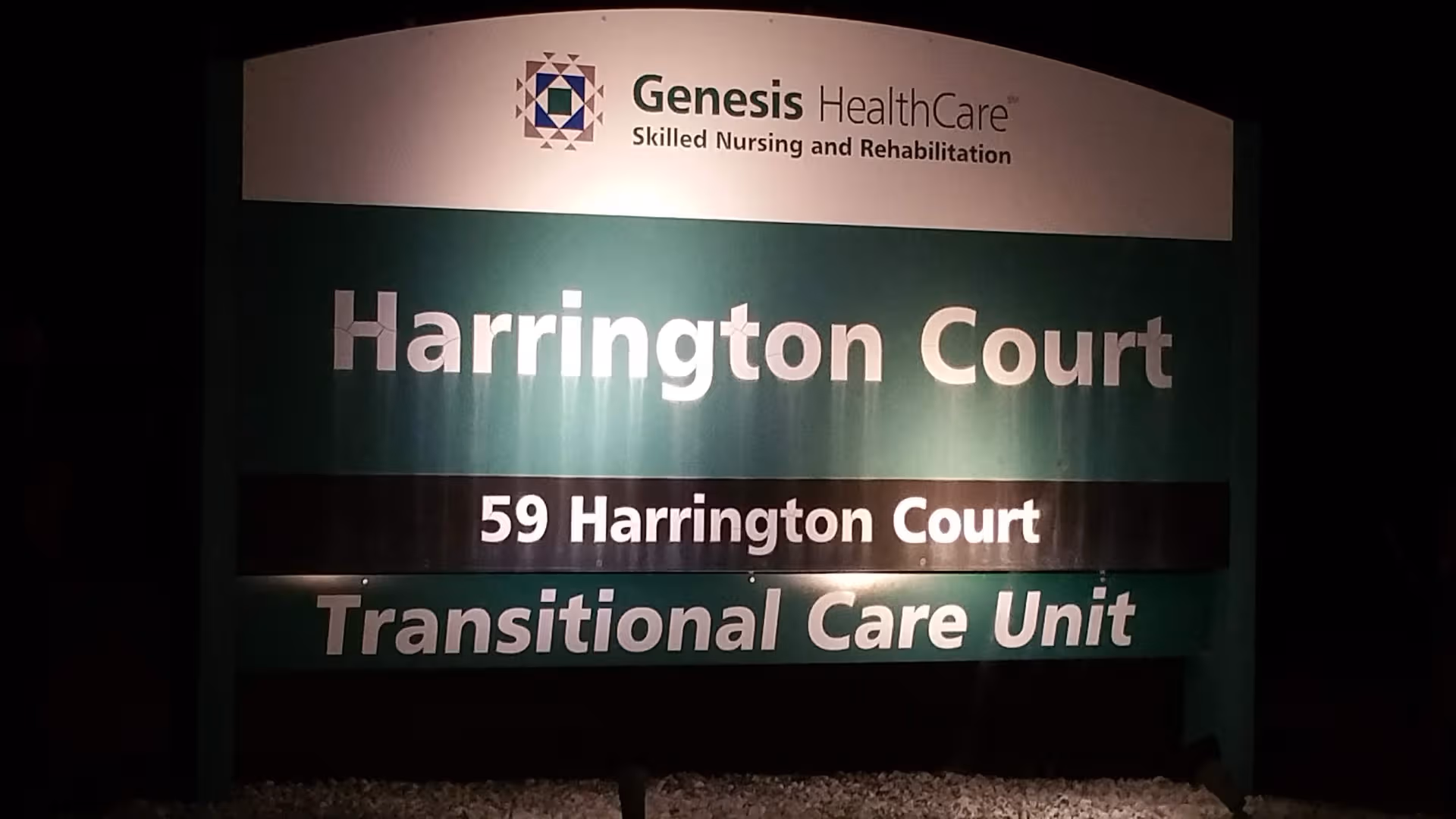 Exterior sign reading Harrington Court Transitional Care Unit with Genesis HealthCare branding.