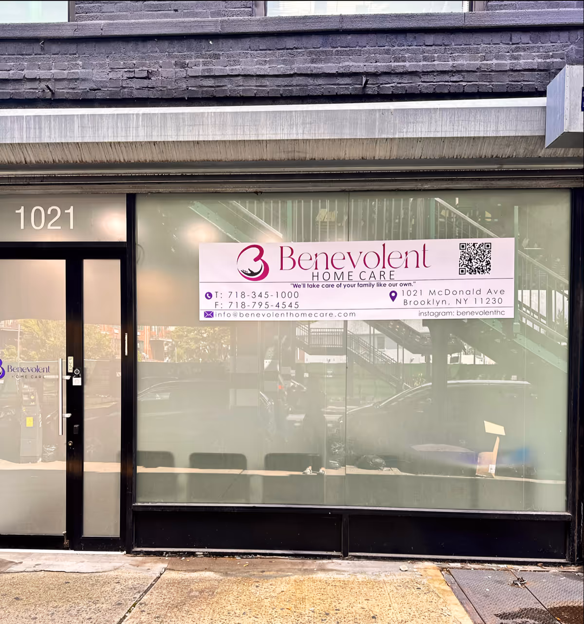 Storefront with Benevolent Home Care banner on glass window and 1021 address near door.
