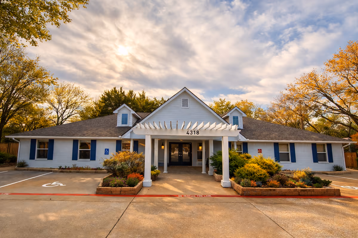 Front view of The Snowberry, a Bouquet Home, a single-story blue building with entrance.