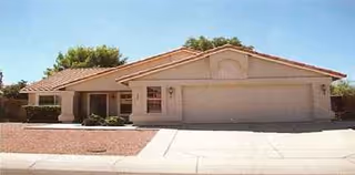 Front exterior view of Best Care Home of Moon Valley, a single-story beige facility.