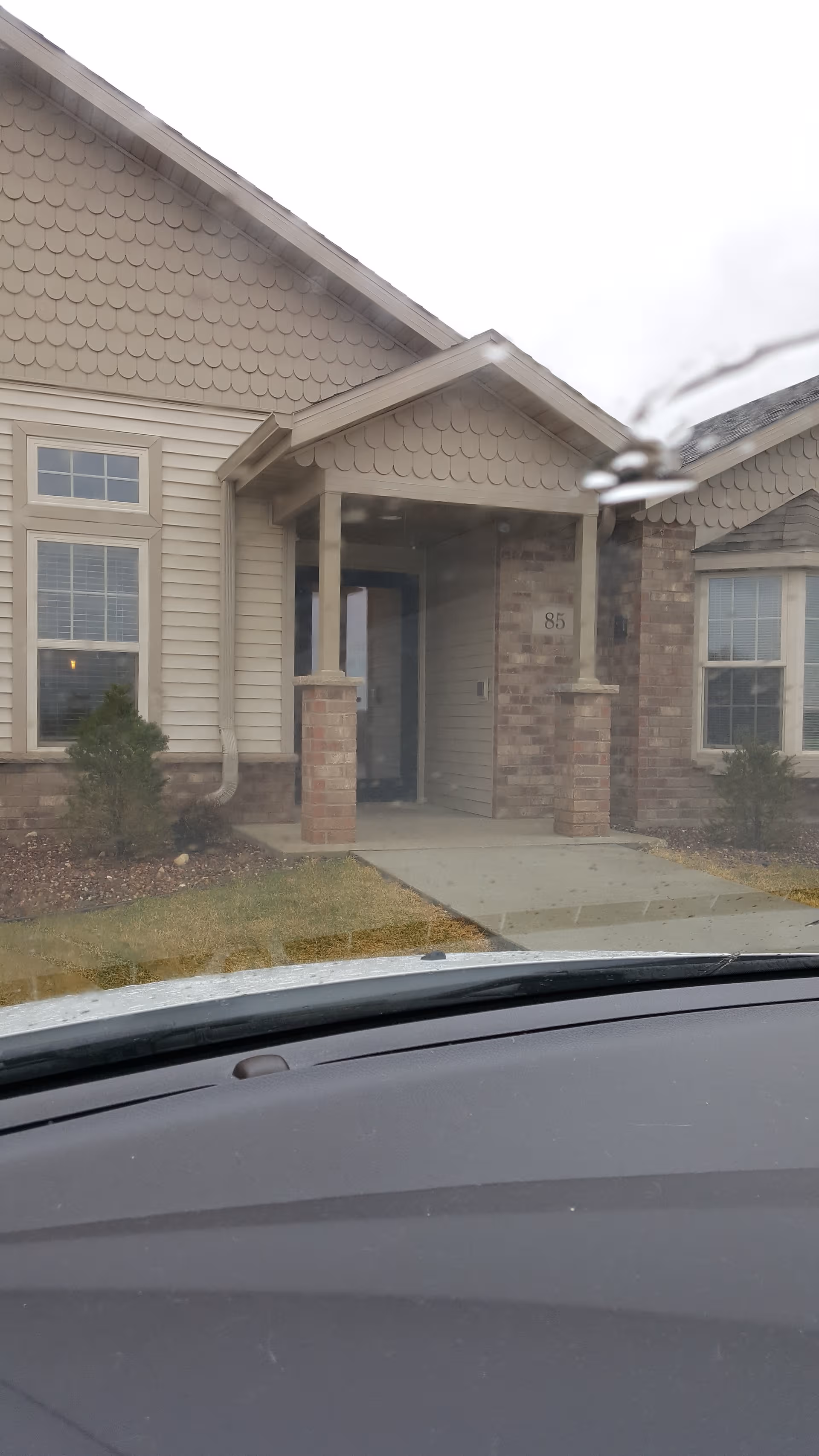 Front entrance of Majestic Heights Assisted Living building with a covered porch.