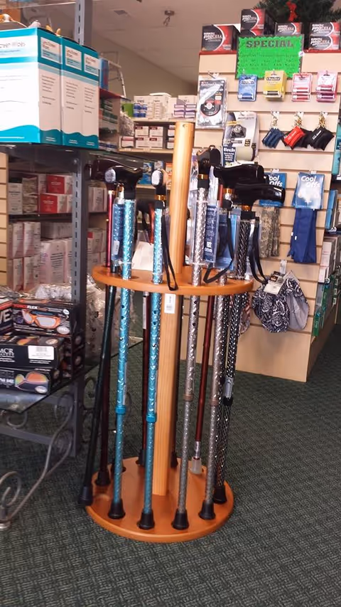 Interior of a medical supply store showing canes and mobility aids on display.